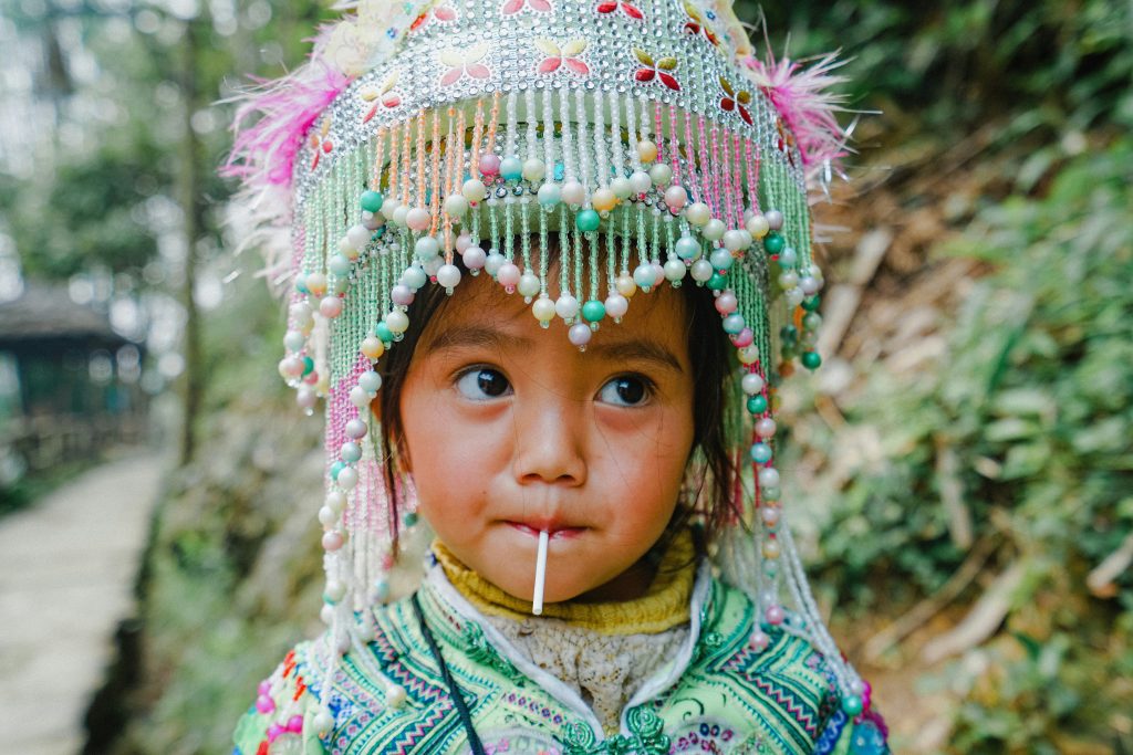 Digital nomad kid in traditional garb