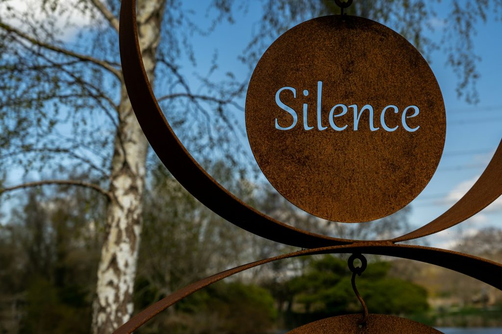 intentional silence - red sign that says silence